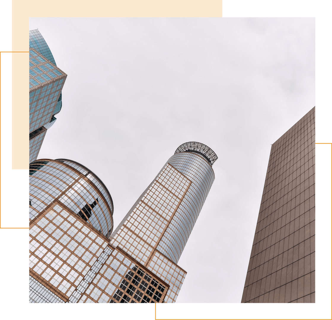 Photo of tall, modern office buildings with glass and steel facades, viewed from below against a cloudy sky, framed by orange and green graphic borders.