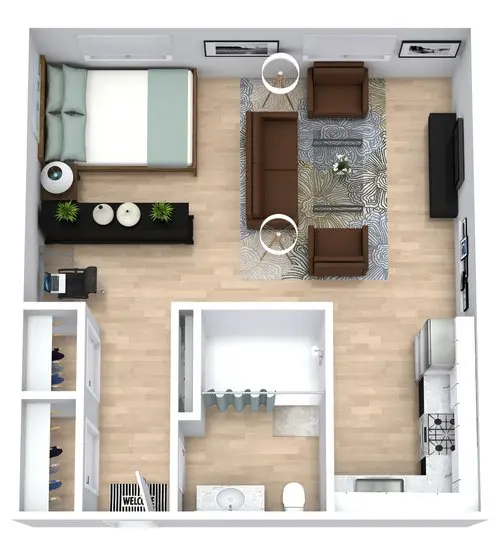 Top view of a studio apartment layout with a bed, living area, kitchen, bathroom, desk, and closet space, featuring modern furniture and light wood flooring.